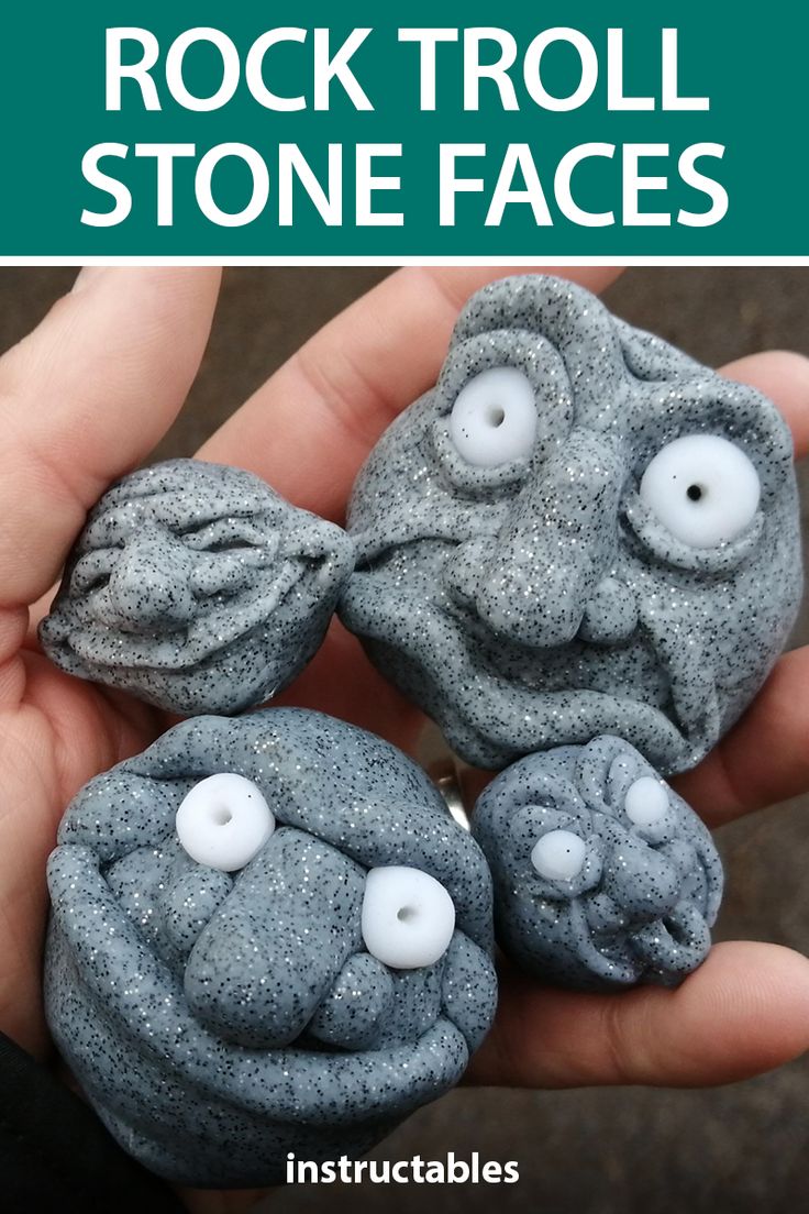 small grey clay troll faces with white button eyes