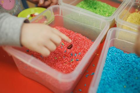 kids playing in rice bin