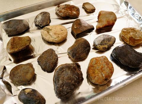 shiny dark rocks on aluminum foil baking sheet