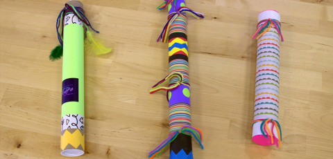 multi color tubes covered with paper and string