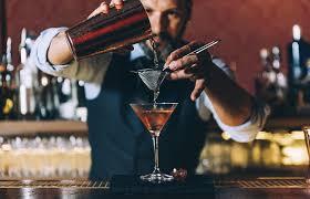 man pouring drinks