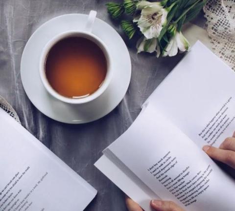 tea next to poetry book