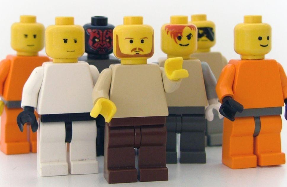 Different lego figures standing together in a line.