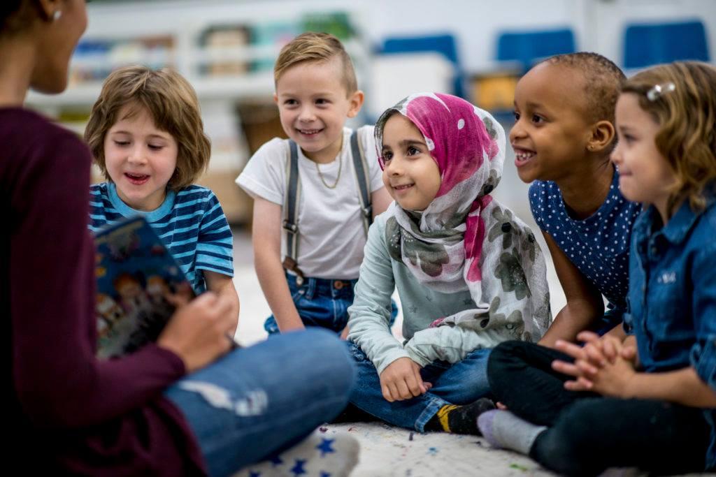 Group of children all reading together