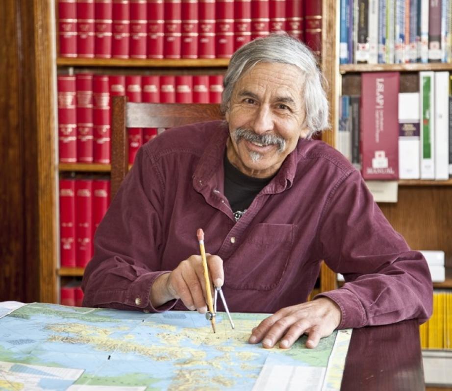 jon turk sitting at a desk smiling