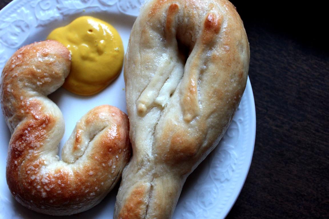 soft homebaked pretzels on a plate with mustard