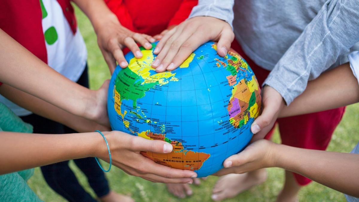 hands holding a globe