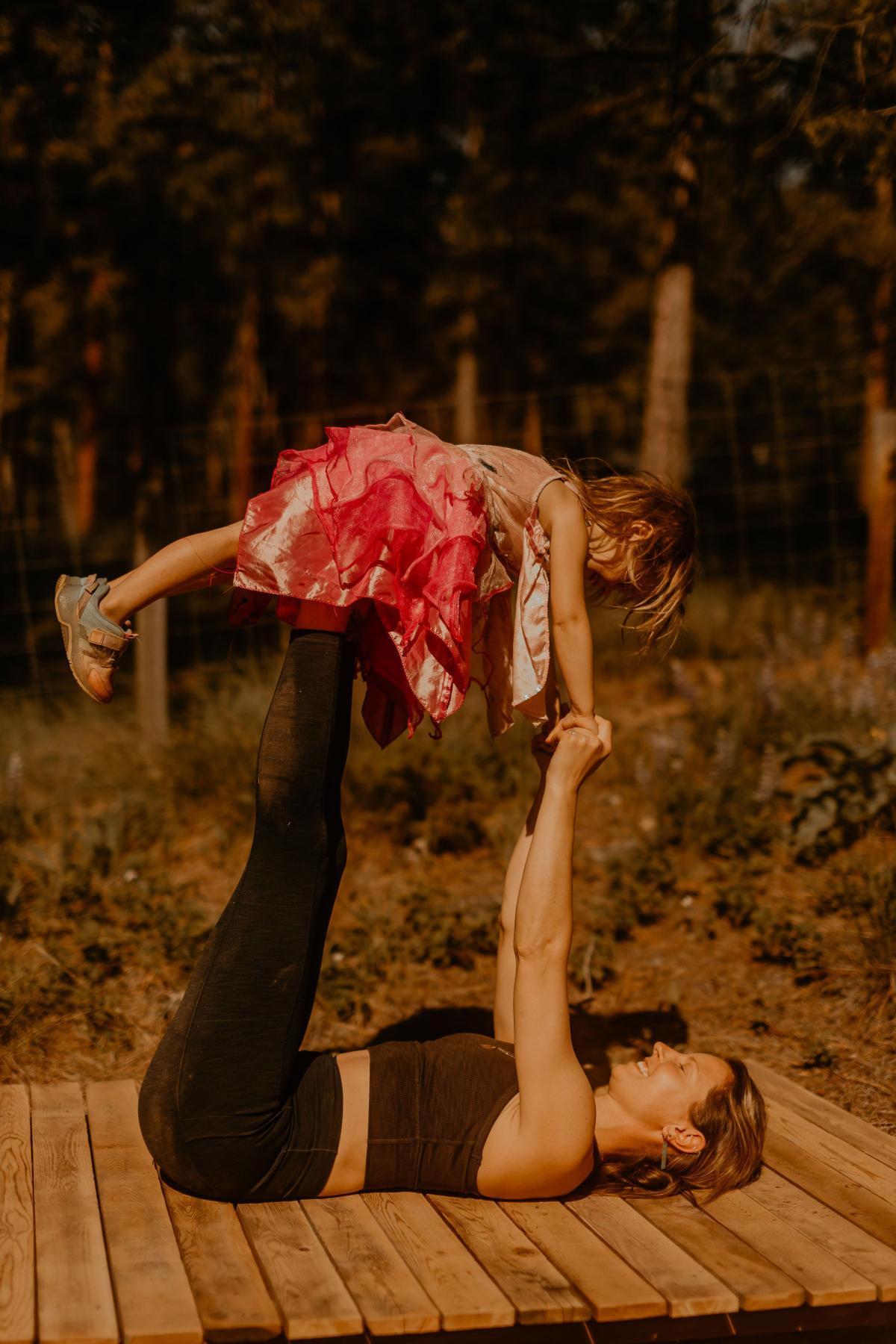 Val and child doing yoga
